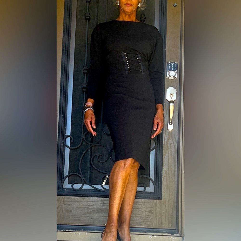 Black tailored dolman sleeve work-to-cocktails dress.